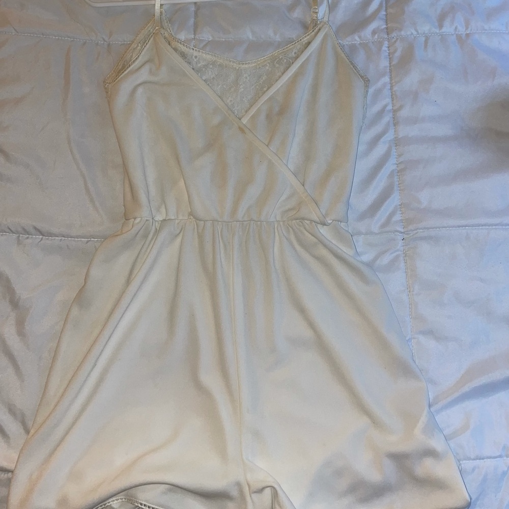 Cream colored romper with lace